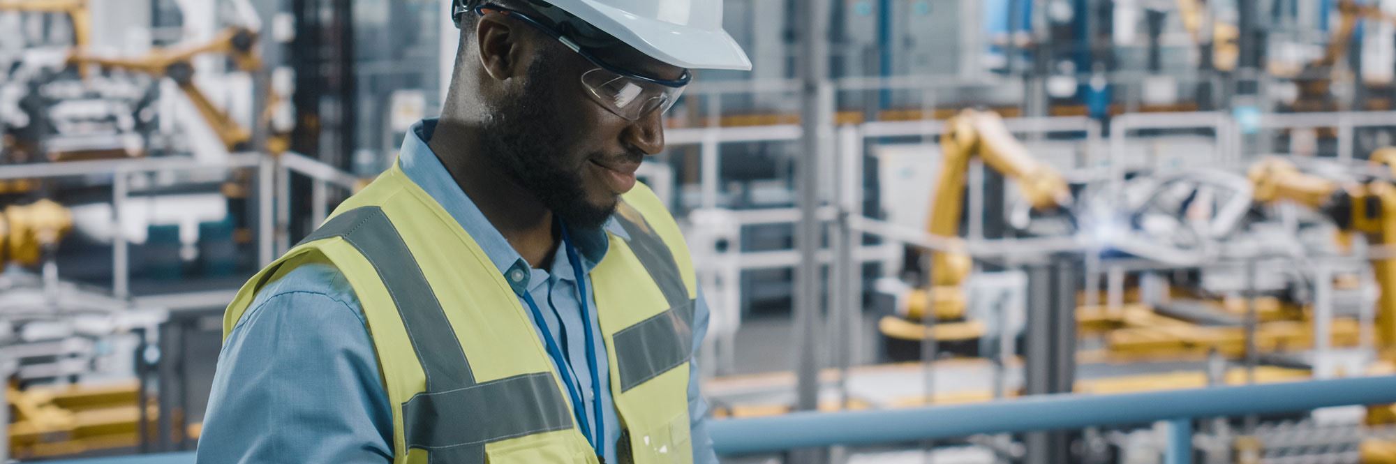 man in robotic facility