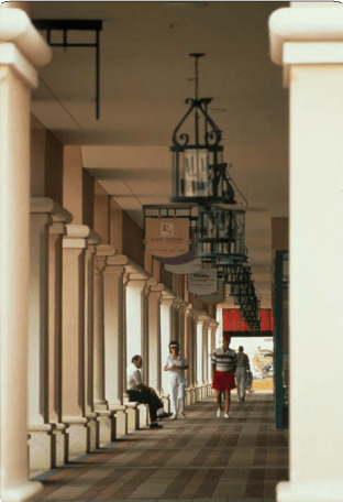 People Walking down the Retail Street